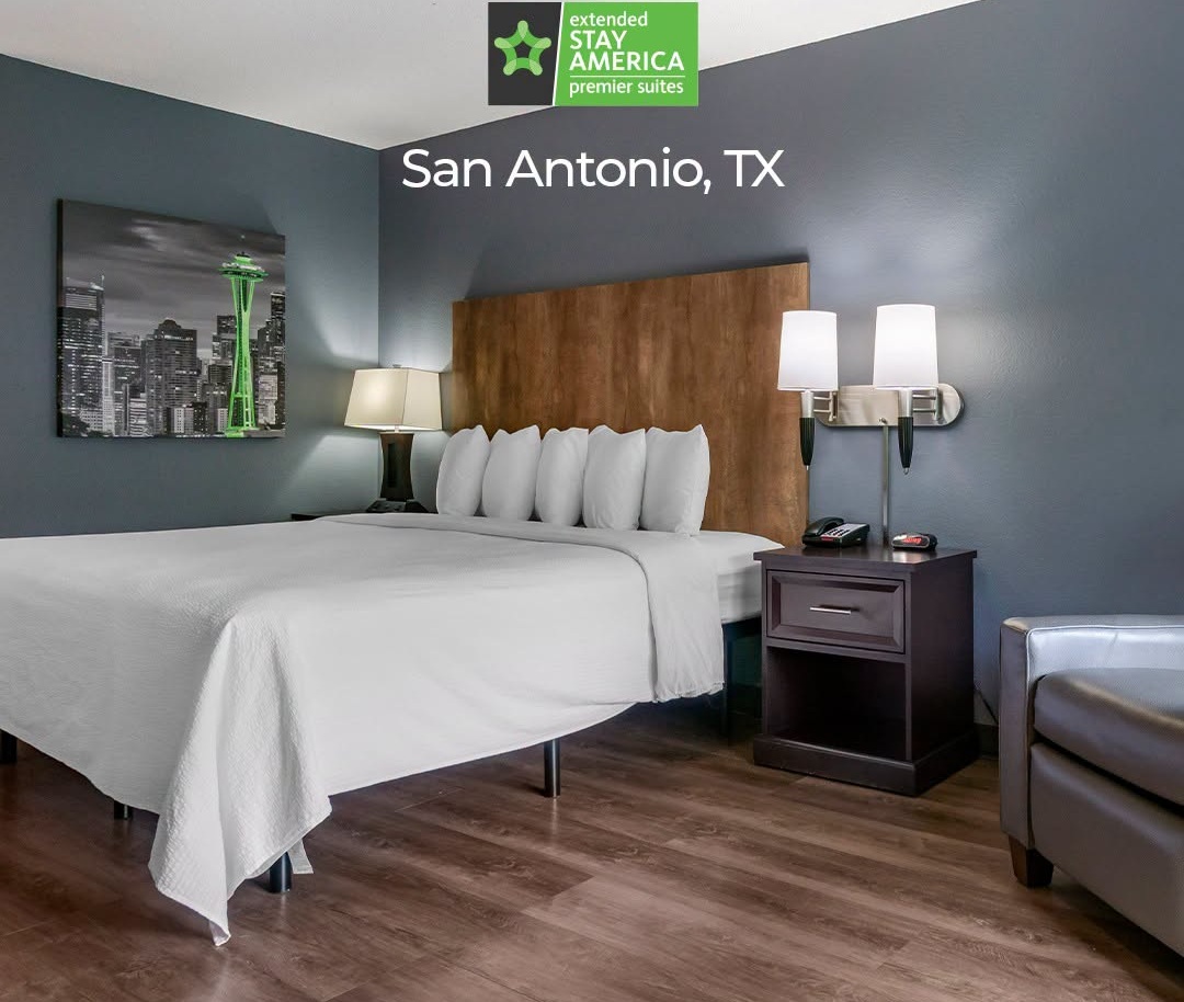 Extended Stay America in-room kitchen with refrigerator, stovetop, and microwave