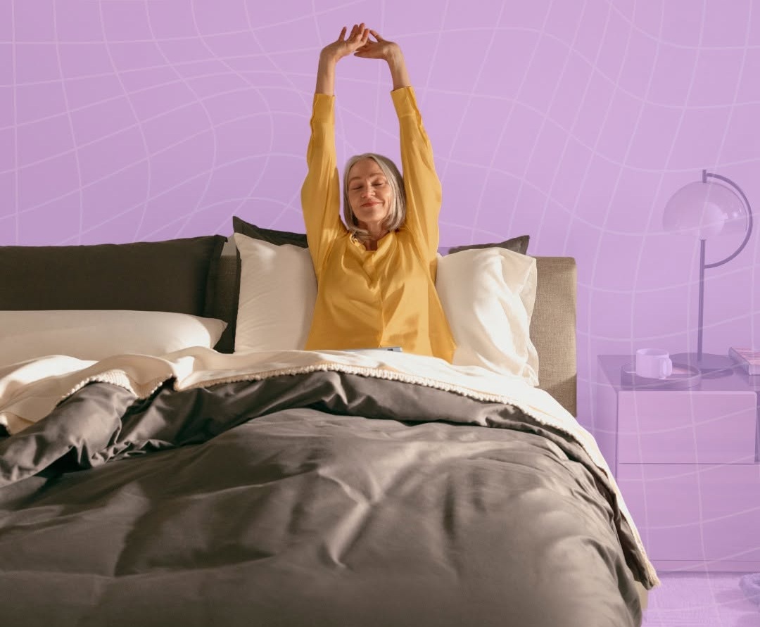 Purple grid pillow and sheets set arranged on a made bed